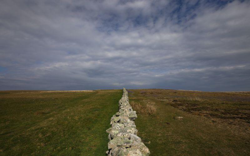 Stratocumulus clouds are seen above the 'Halfway Wall' during the Cloud Appreciation Society's gathering in Lundy, Britain, May 18, 2019. Picture taken May 18, 2019.
