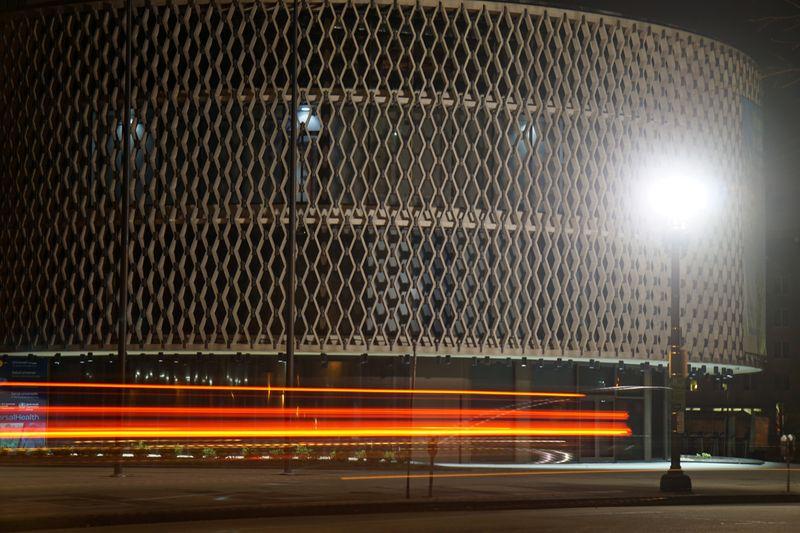 Traffic passes the Regional Office for the Americas of the World Health Organization (WHO) during the coronavirus disease (COVID-19) outbreak in Washington, D.C., U.S. March 22, 2020. Picture taken with a long exposure. Picture taken March 22, 2020. REUTERS/Raphael Satter
