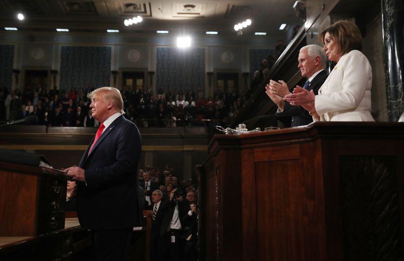 U.S. President Donald Trump arrives in front of Vice President Mike Pence and Speaker of the House Nancy Pelosi to deliver his State of the Union address to a joint session of the U.S. Congress in the House Chamber of the U.S. Capitol in Washington, U.S. February 4, 2020. REUTERS/Leah Millis/POOL - HP1EG25098GC7
