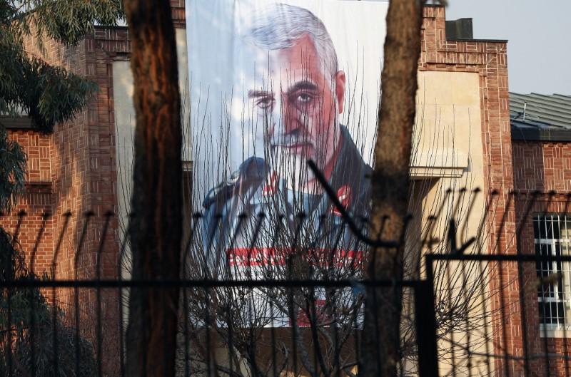 A picture of Iranian Major-General Qassem Soleimani, head of the elite Quds Force, who was killed in an air strike at Baghdad airport, is seen on the former U.S. Embassy's building in Tehran, Iran January 7, 2020. Nazanin Tabatabaee/WANA (West Asia News Agency)
