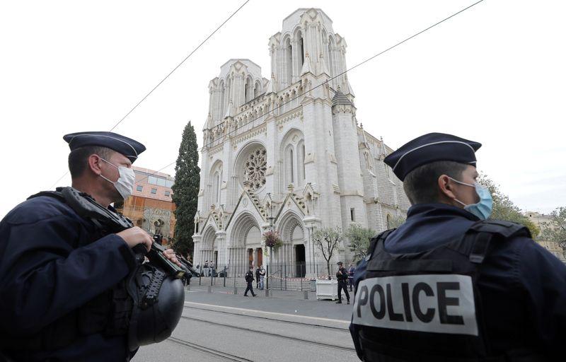 Police officers stand guard at the scene of a reported knife attack at Notre Dame church in Nice, France, October 29, 2020. REUTERS/Eric Gaillard