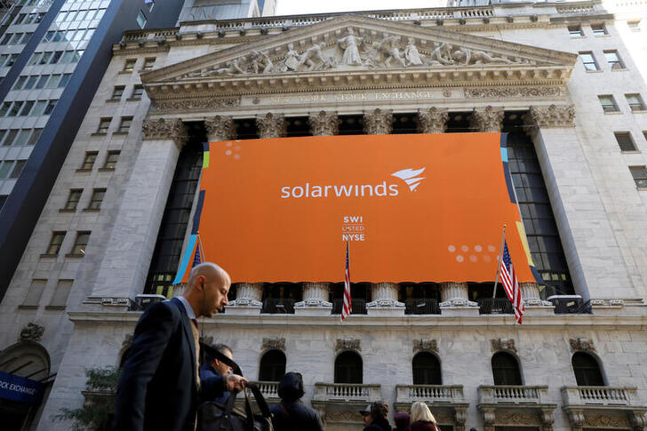 FILE PHOTO: SolarWinds Corp. banner hangs at the New York Stock Exchange (NYSE) on the IPO day of the company in New York, U.S., October 19, 2018. REUTERS/Brendan McDermid/File Photo