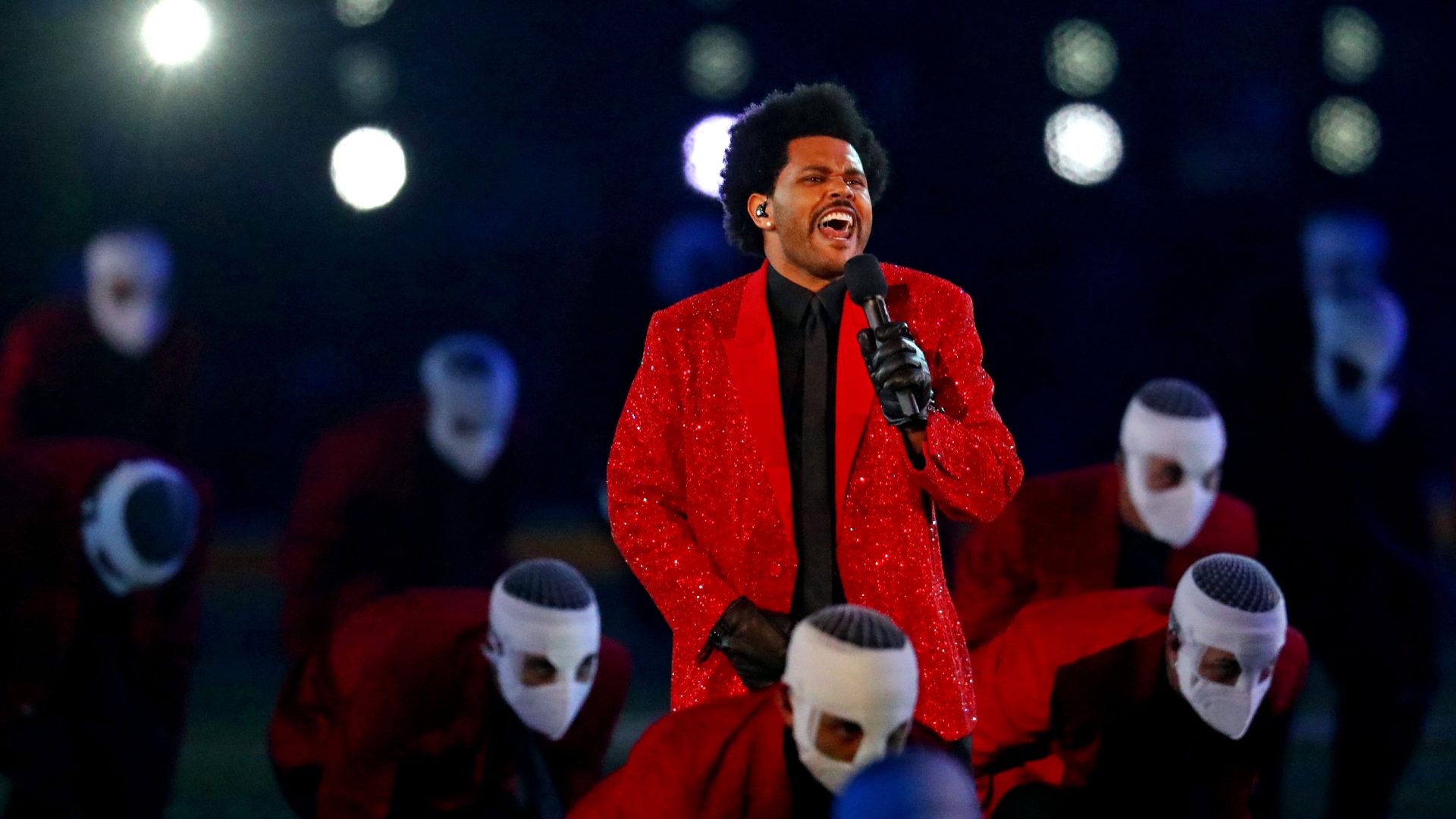 NFL The Weeknd brings bright lights, bandaged dancers to Super Bowl