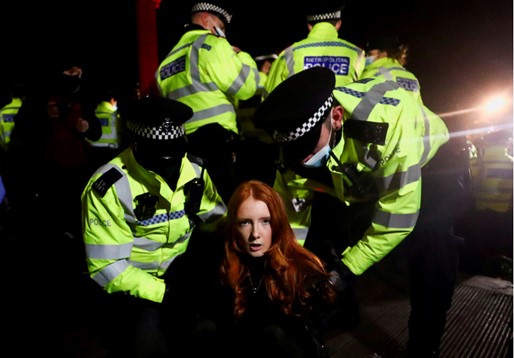 Reuters captures clashes at vigil for murdered woman in London with stunning photography, video