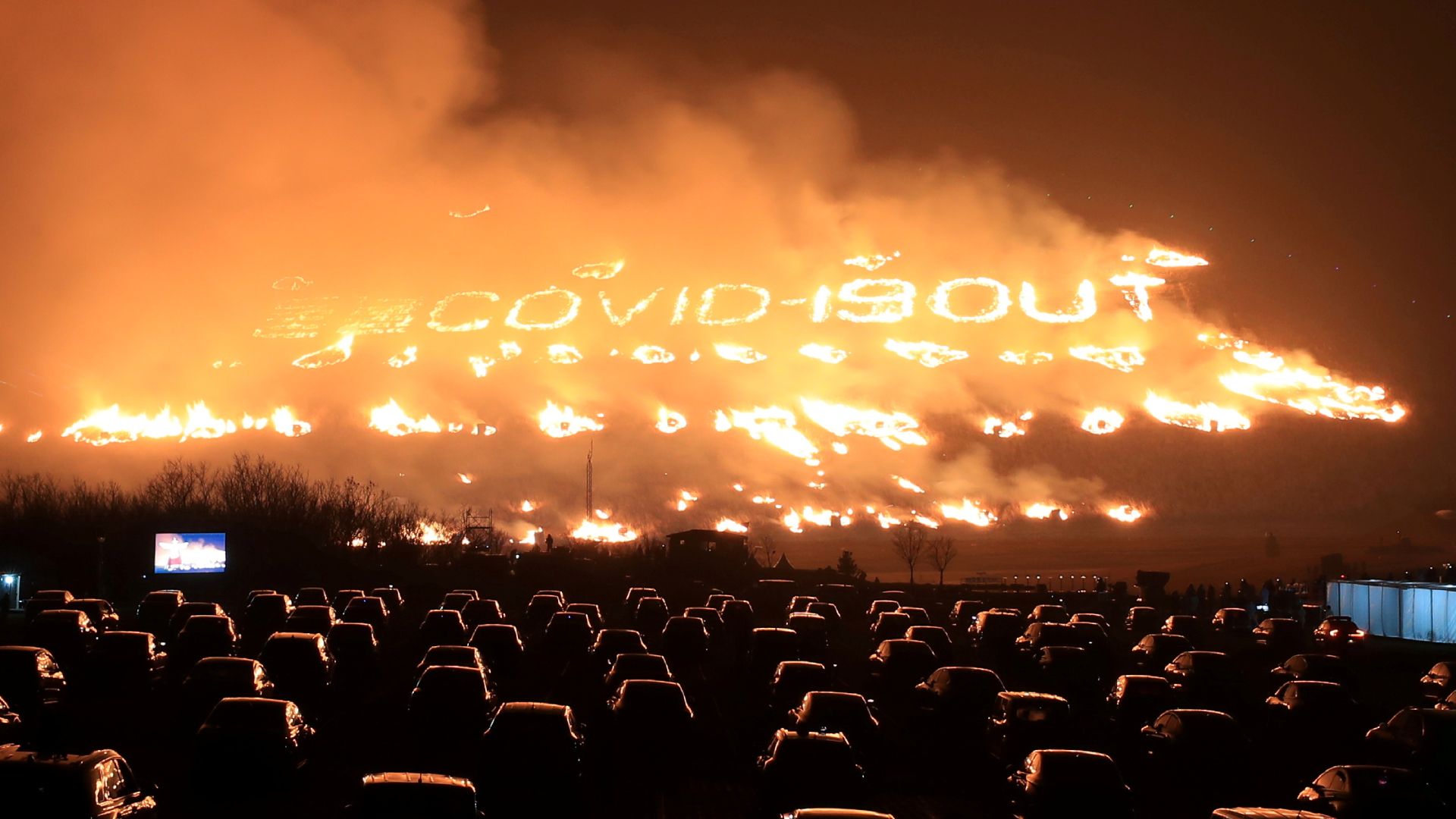 Spectators sitting inside their vehicles enjoy Jeju Fire Festival in South Korea