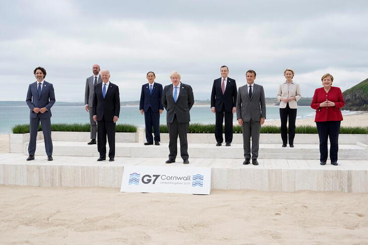 Canadian Prime Minister Justin Trudeau, European Council President Charles Michel, U.S. President Joe Biden, Japan's Prime Minister Yoshihide Suga, British Prime Minister Boris Johnson, Italy's Prime Minister Mario Draghi, French President Emmanuel Macron, European Commission President Ursula von der Leyen and German Chancellor Angela Merkel pose for a group photo at the G7 summit, in Carbis Bay, Britain, June 11, 2021. Patrick Semansky/Pool via REUTERS     TPX IMAGES OF THE DAY