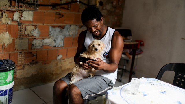 Scholar by day, street-sweeper by night, one Black man navigates Rio’s racial divide