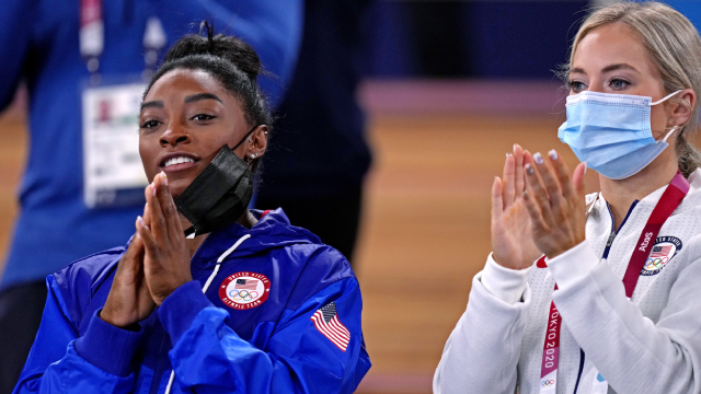 Gymnastics-Pep talk from Biles helps Carey power to gold