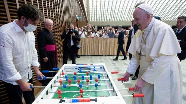 Pope Francis plays table football at the Vatica