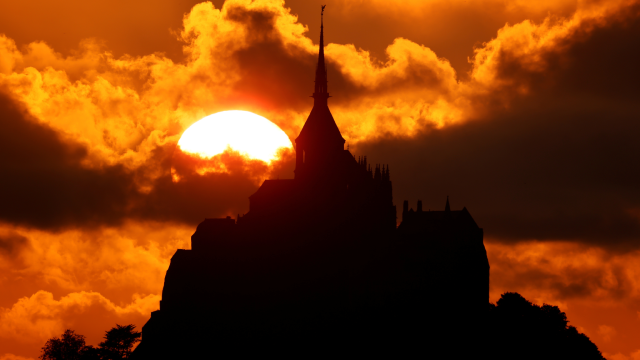 The iconic Mont Saint-Michel is seen at sunset in the western region of Normandy