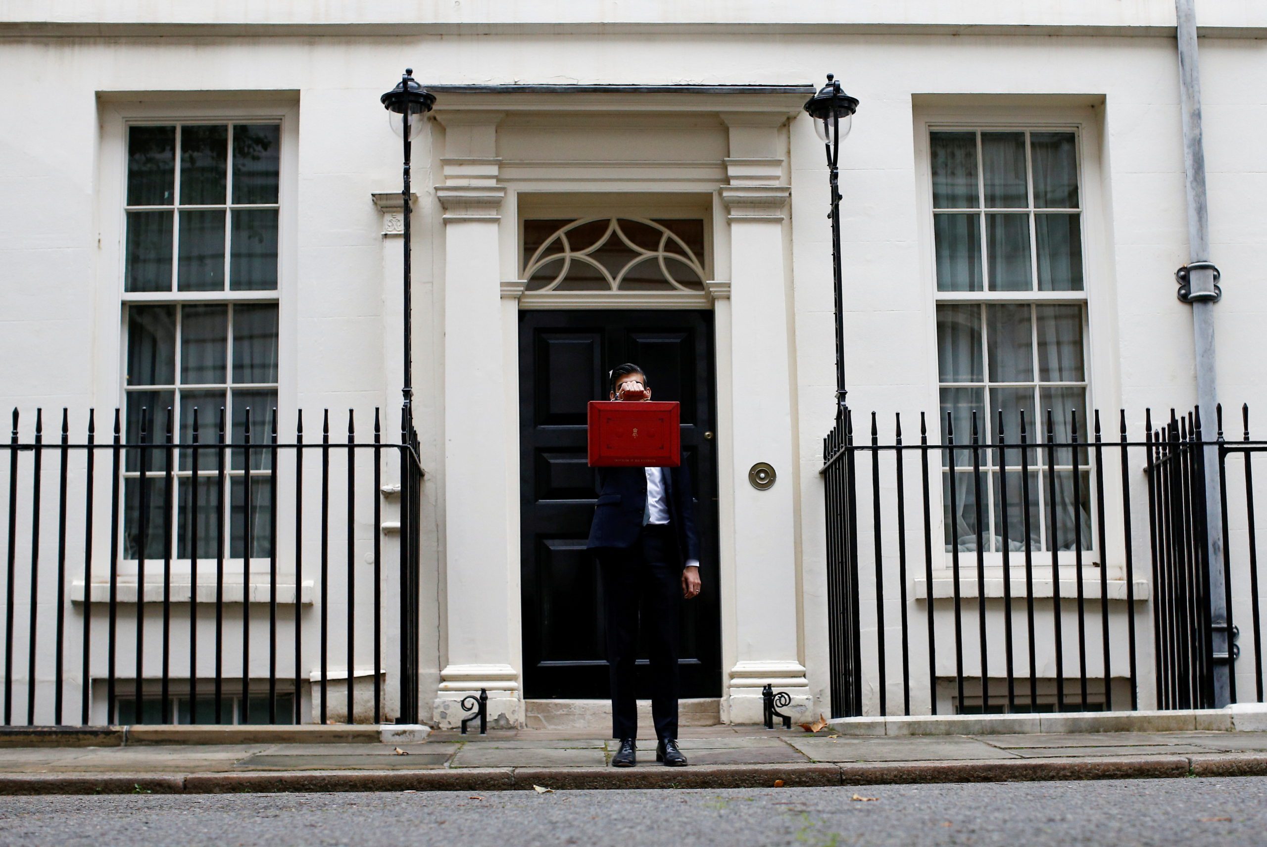 Chancellor of the Exchequer Sunak holds the budget box outside Downing Street in London