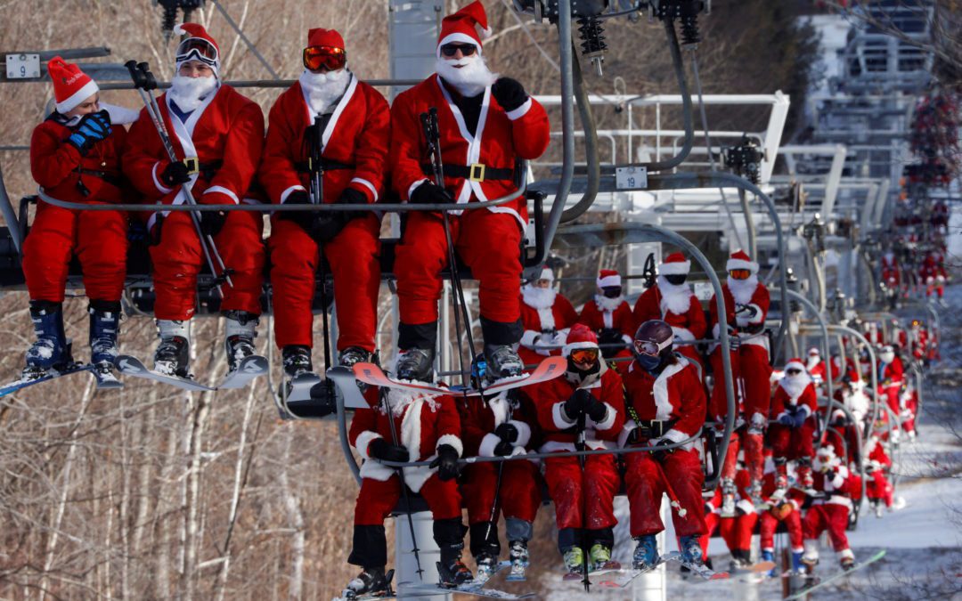 Skiers dressed as Santa take part in Santa Sunday at Sunday River ski resort in Bethel