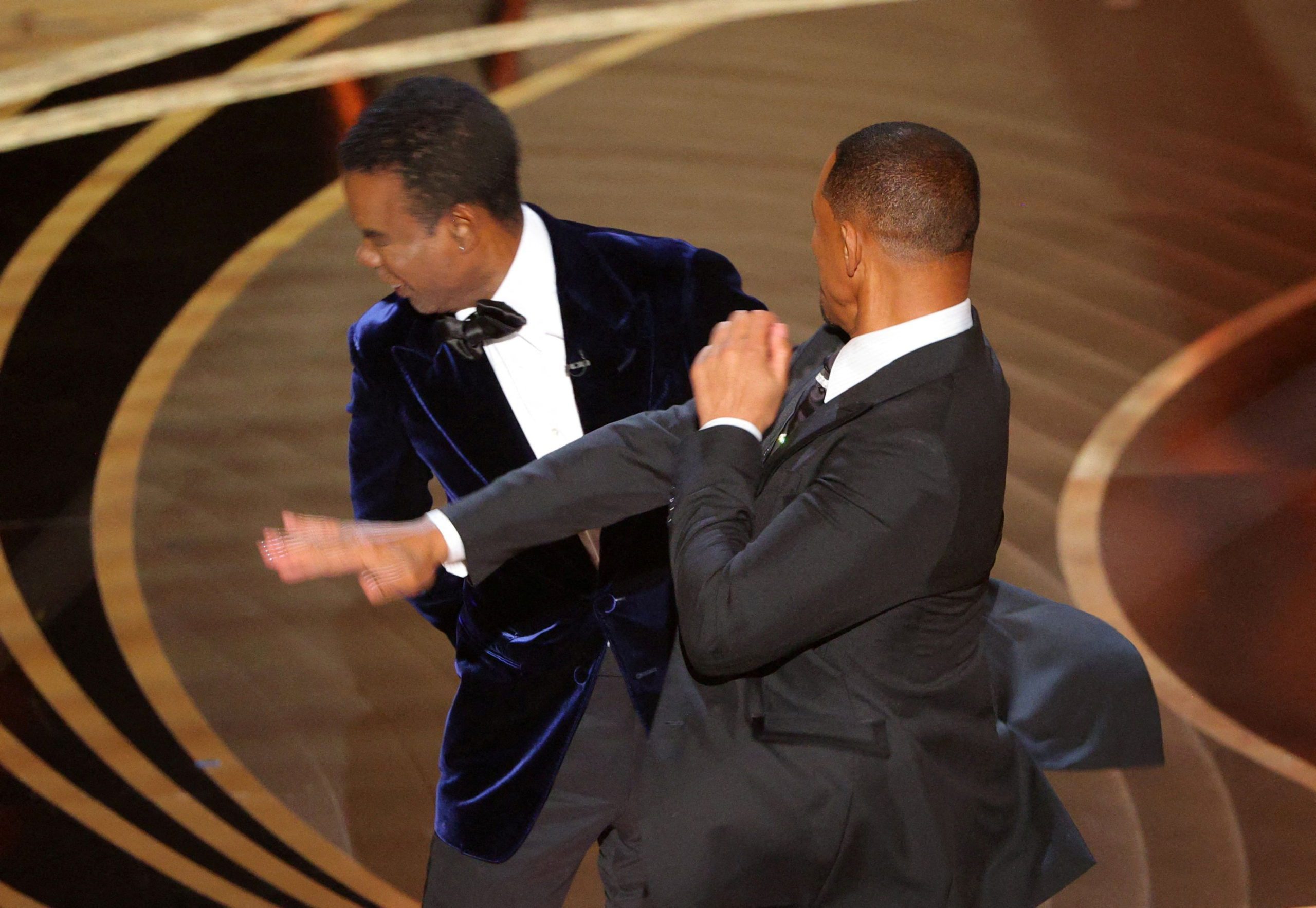 Will Smith hits at Chris Rock as Rock spoke on stage during the 94th Academy Awards in Hollywood, Los Angeles, California, U.S., March 27, 2022. REUTERS/Brian Snyder     