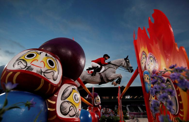 Tokyo 2020 Olympics - Equestrian - Eventing - Jumping Individual - Qualification - Equestrian Park - Tokyo, Japan - August 2, 2021. Melody Johner of Switzerland on her horse Toubleu De Rueire competes. REUTERS/Molly Darlington/File photo