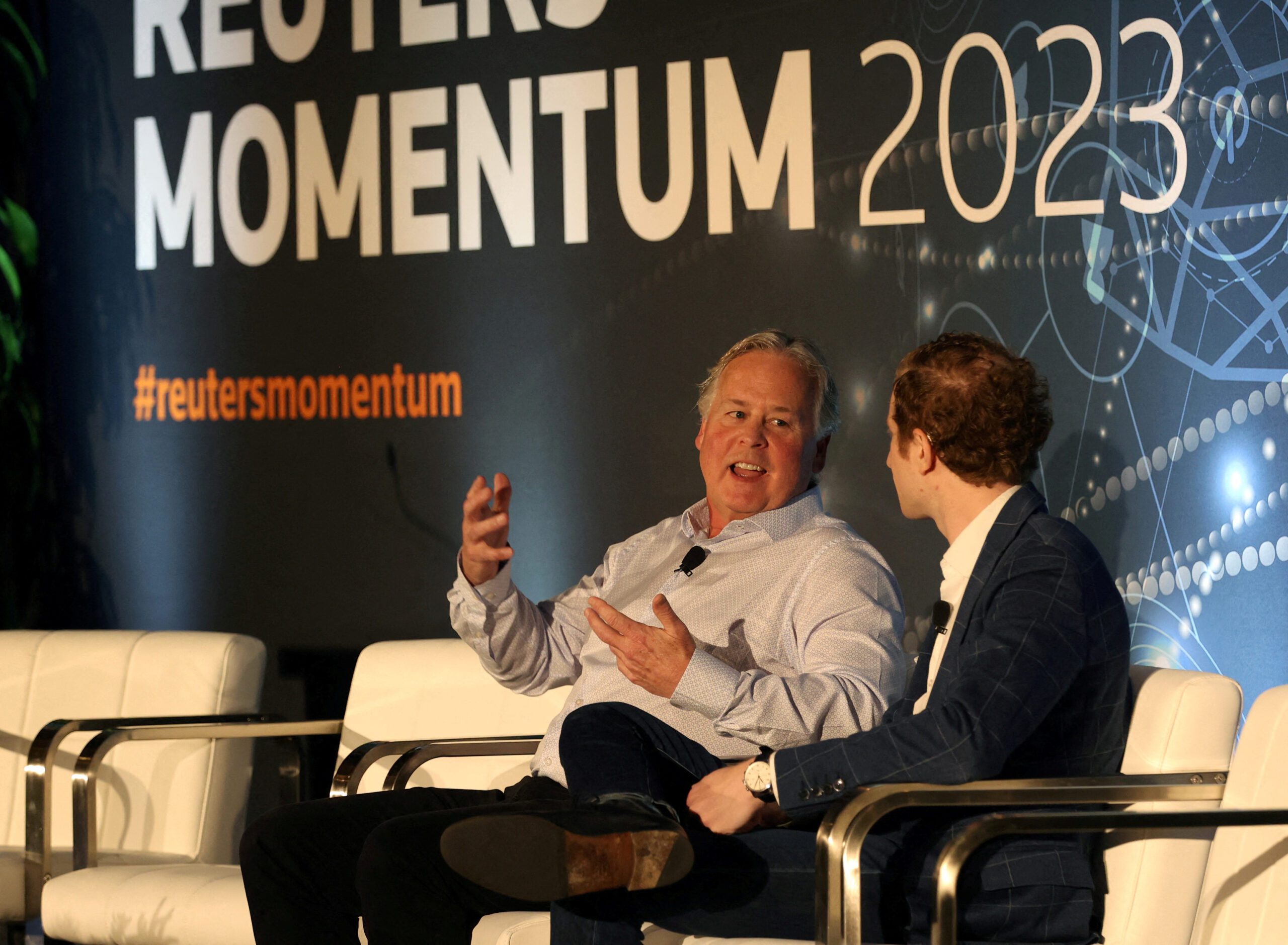 Bradley Peterson, EVP, chief information and technology officer for Nasdaq, left, answers questions from Reuters correspondent Jeffrey Dastin during the Reuters MOMENTUM event, held to discuss the development and use of AI in Austin, Texas, U.S. July 11, 2023.  REUTERS/Nuri Vallbona