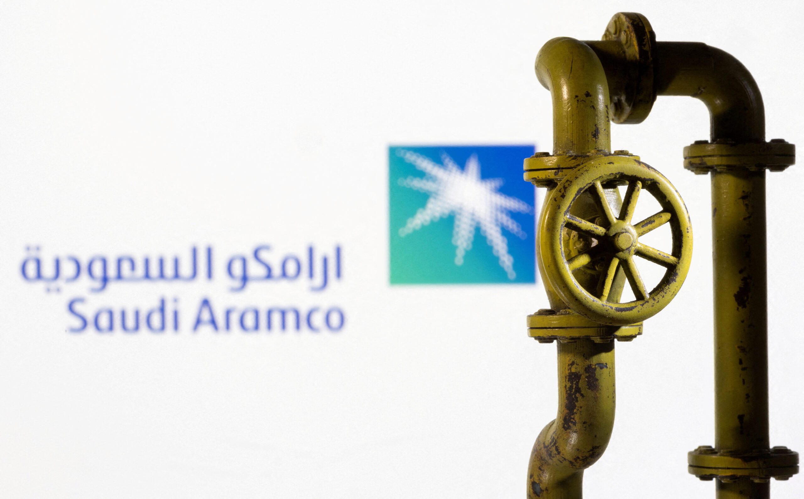 FILE PHOTO: A 3D printed natural gas pipeline is placed in front of displayed Saudi Aramco logo in this illustration taken February 8, 2022. REUTERS/Dado Ruvic/File Photo