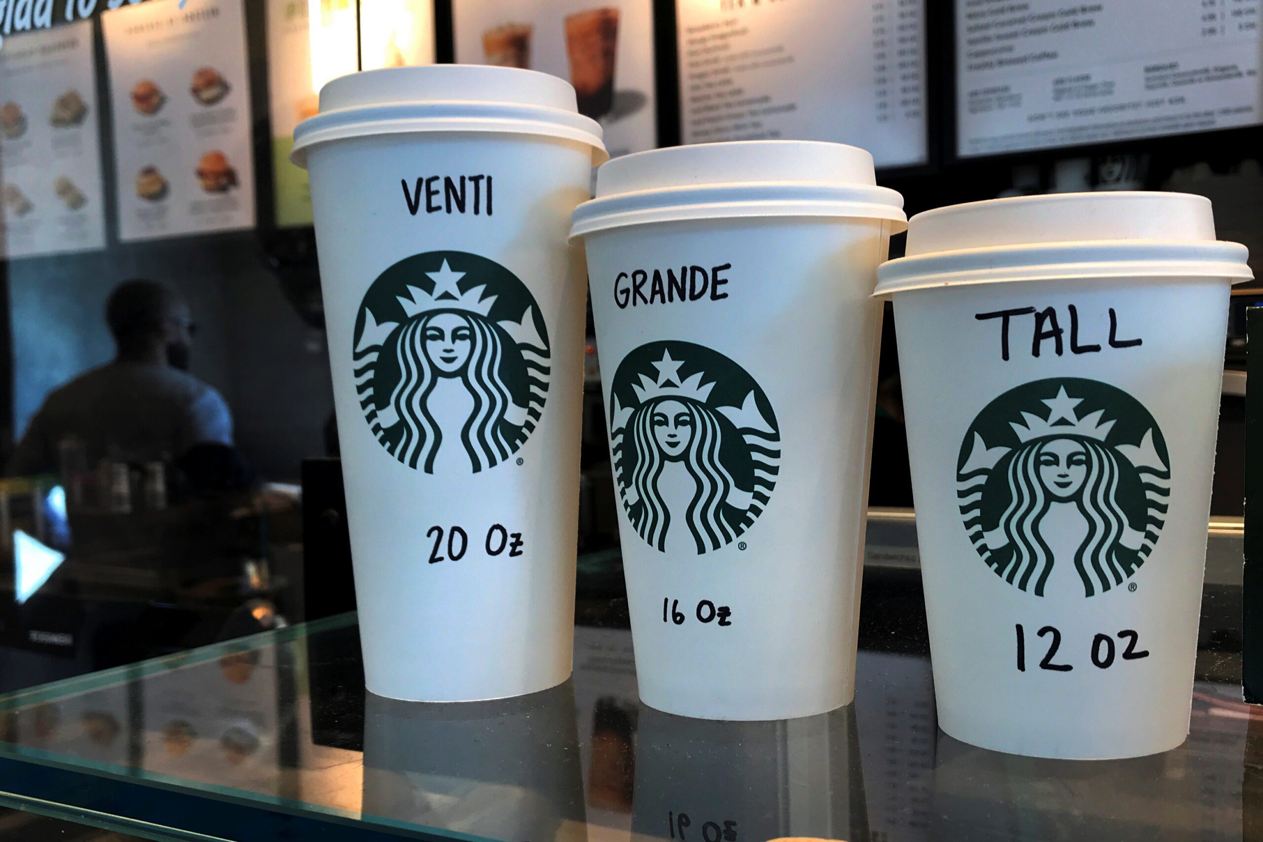 Starbucks cups are pictured on a counter in the Manhattan borough of New York City, New York, U.S., February 16, 2022. REUTERS/Carlo Allegri