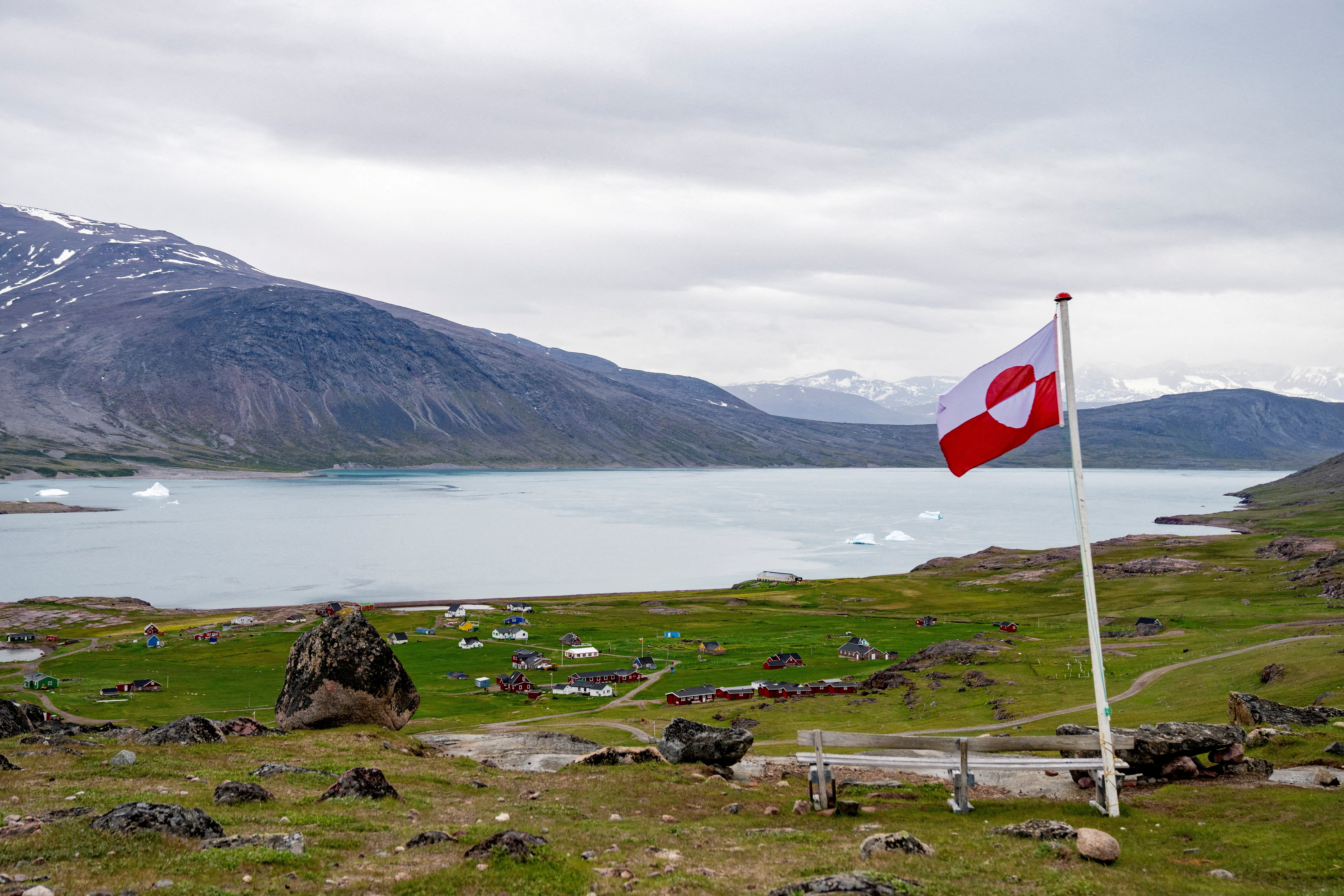 FILE PHOTO: Greenland's flag flies in Igaliku settlement, Greenland, July 5, 2024. Ritzau Scanpix/Ida Marie Odgaard via REUTERS/File Photo ATTENTION EDITORS - THIS IMAGE WAS PROVIDED BY A THIRD PARTY. DENMARK OUT. NO COMMERCIAL OR EDITORIAL SALES IN DENMARK./File Photo